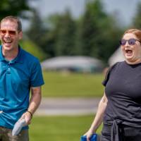 Two players laugh and smile during a game